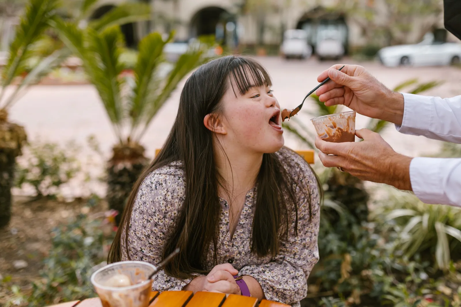 Woman smiling up at her support person